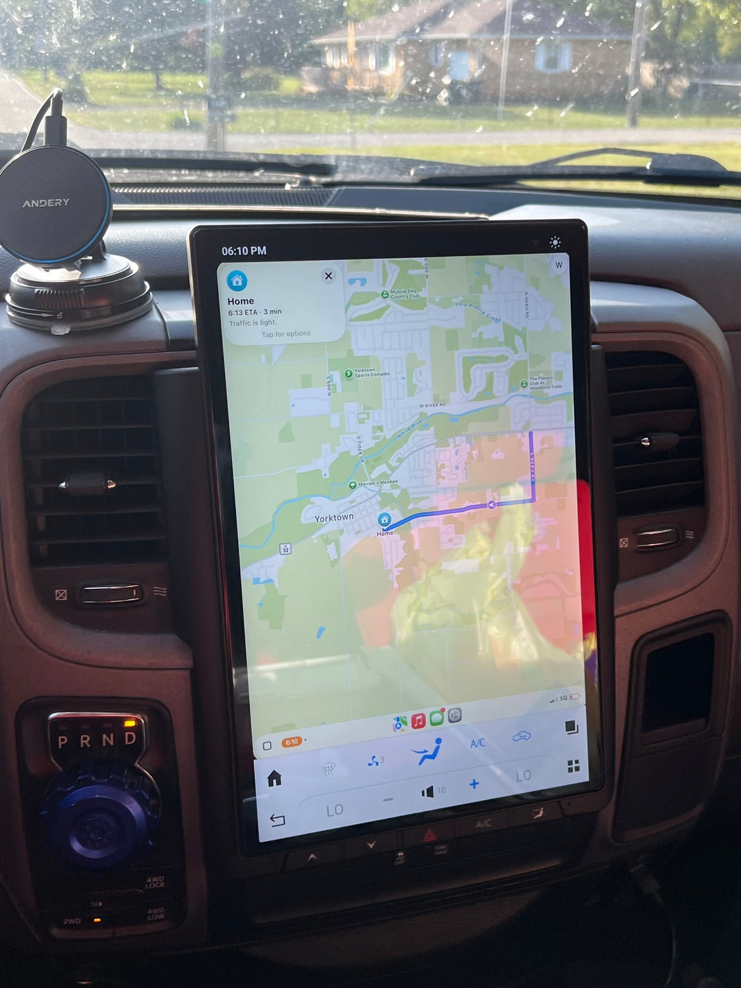 Tesla-style MergeScreens display installed in a Ram dashboard, showing CarPlay maps