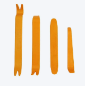 Four orange trim removal tools